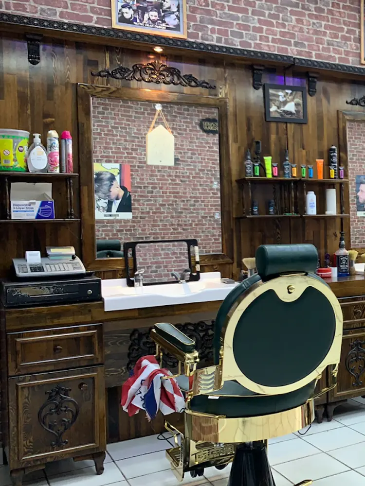 Antique green and brass barber chair at Marmaris Turkish Barbers